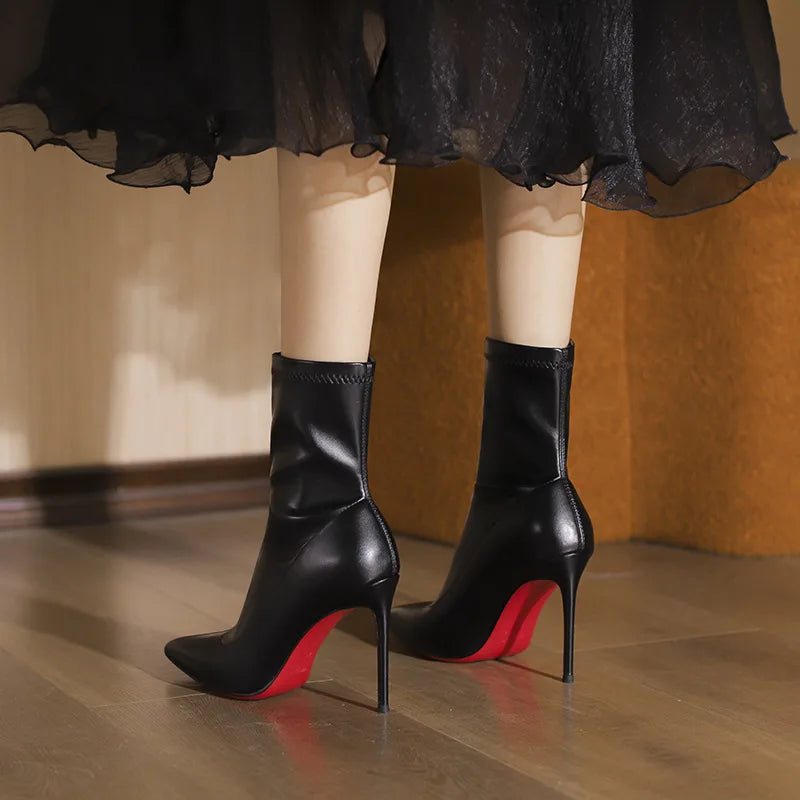 2025 autumn and winter new elastic slim boots with pointed leather and thin heels, black short boots for women with temperament