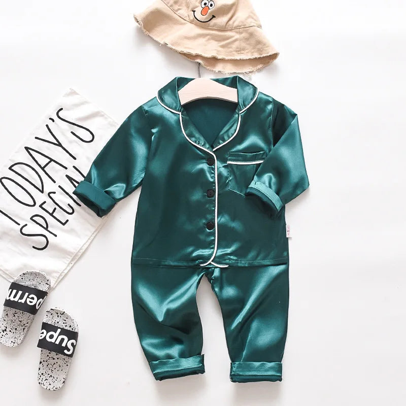 Korean version of childrens pajamas set silk satin long sleeve top+trousers two -piece male baby girl cartoon solid color set