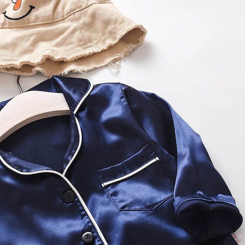 Korean version of childrens pajamas set silk satin long sleeve top+trousers two -piece male baby girl cartoon solid color set