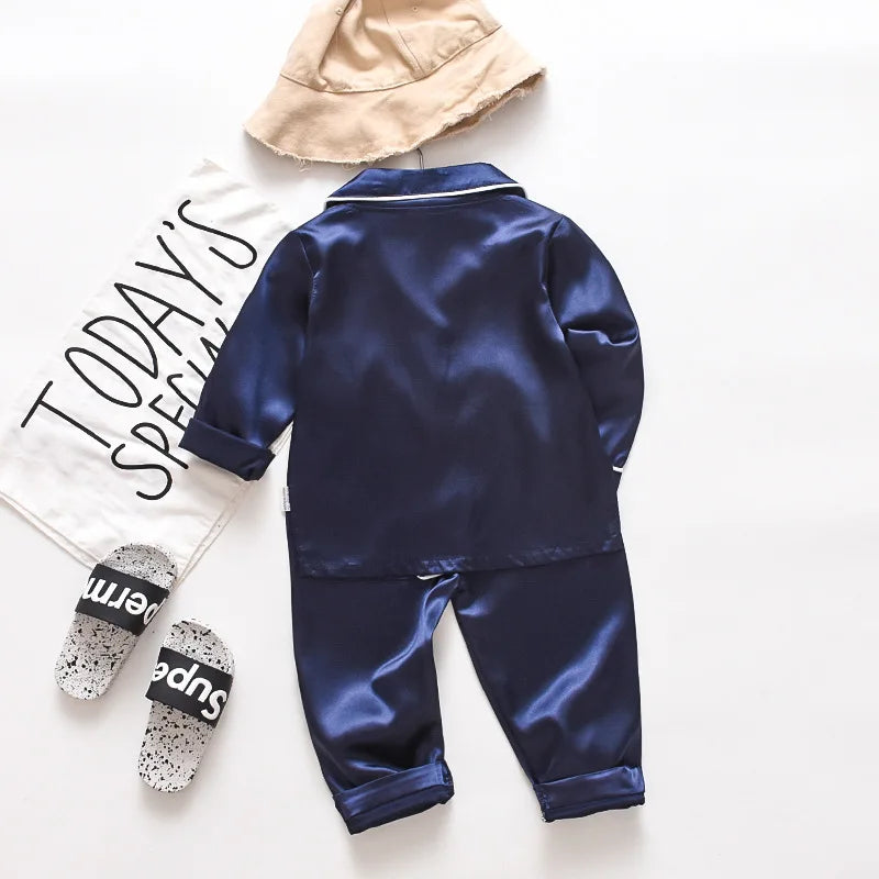 Korean version of childrens pajamas set silk satin long sleeve top+trousers two -piece male baby girl cartoon solid color set