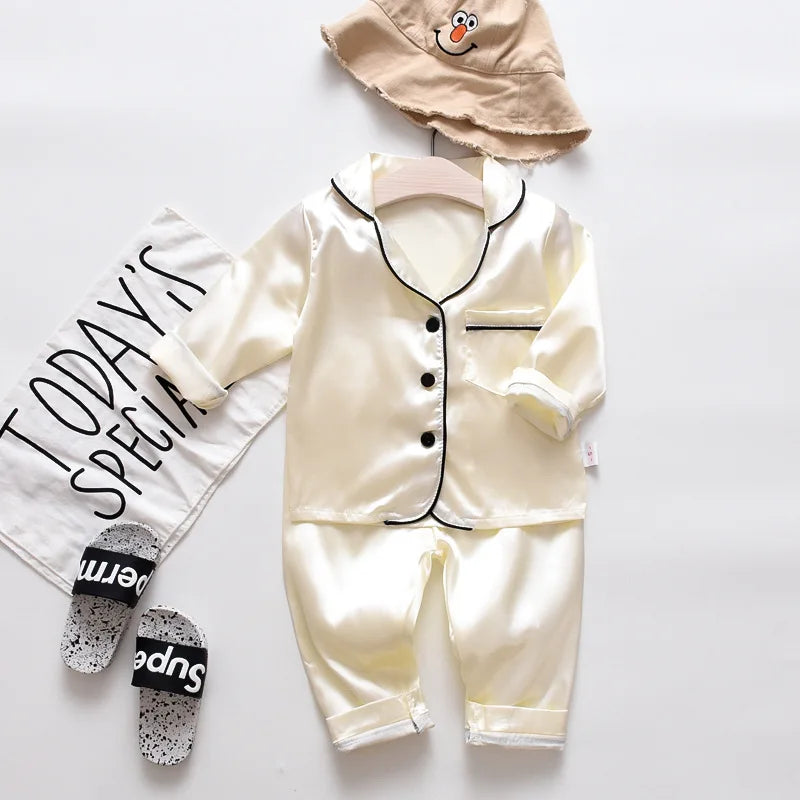 Korean version of childrens pajamas set silk satin long sleeve top+trousers two -piece male baby girl cartoon solid color set