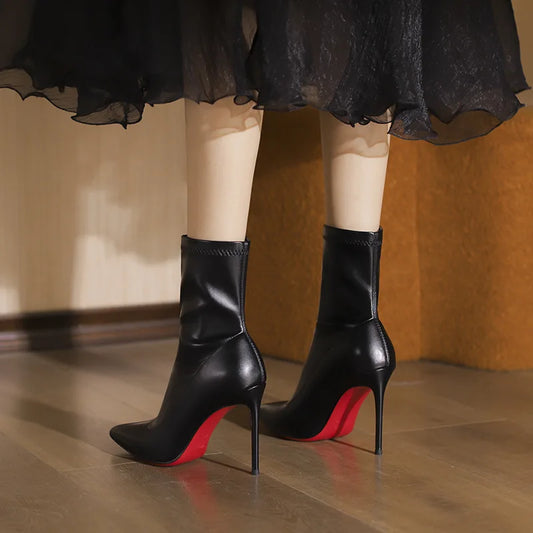 2025 autumn and winter new elastic slim boots with pointed leather and thin heels, black short boots for women with temperament